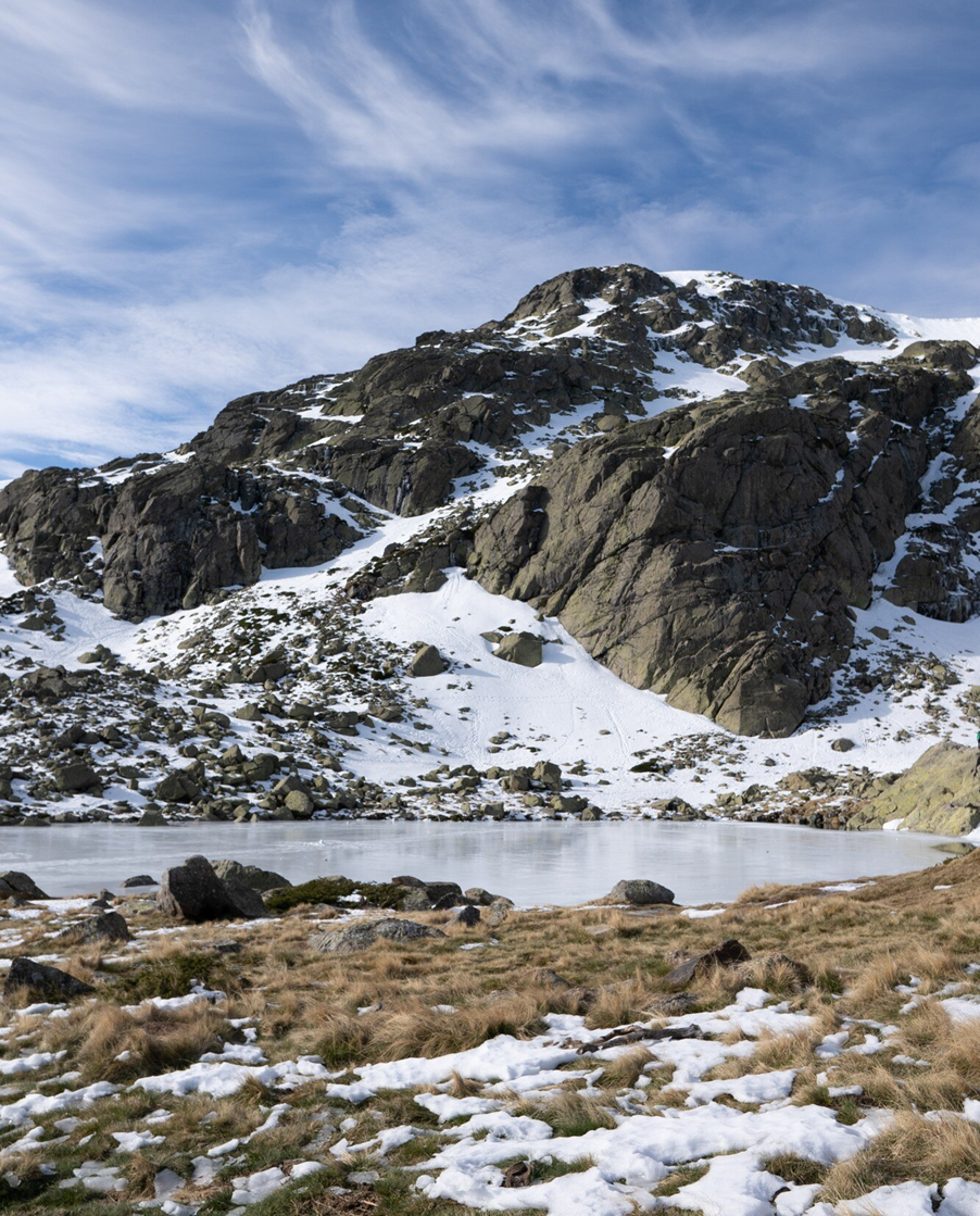 A snowy mountain with a lake
AI-generated content may be incorrect.